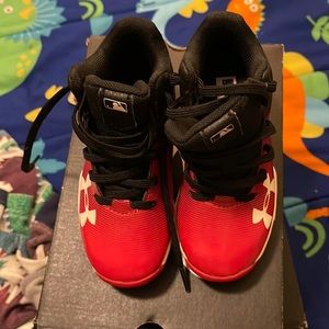 Need cleats for baseball season! Red And Black Under Armour Clears size 9